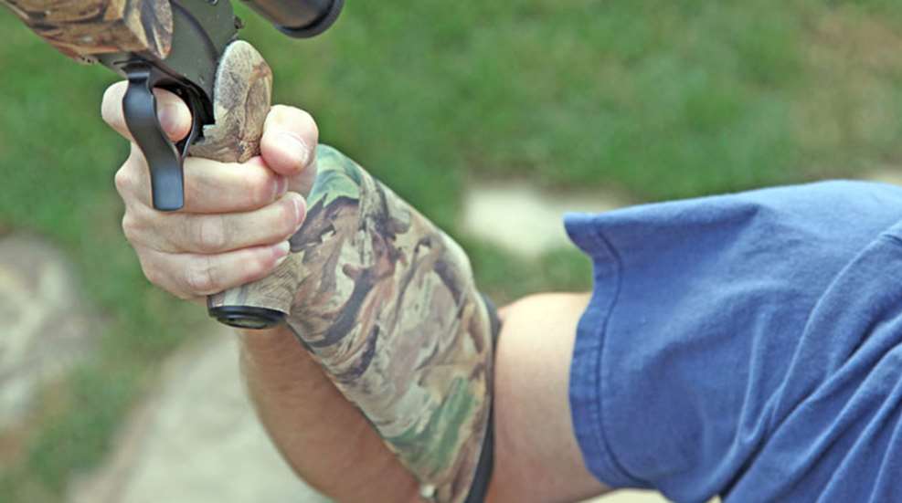 demonstrating length of pull with shotgun stock slotted into inner elbow