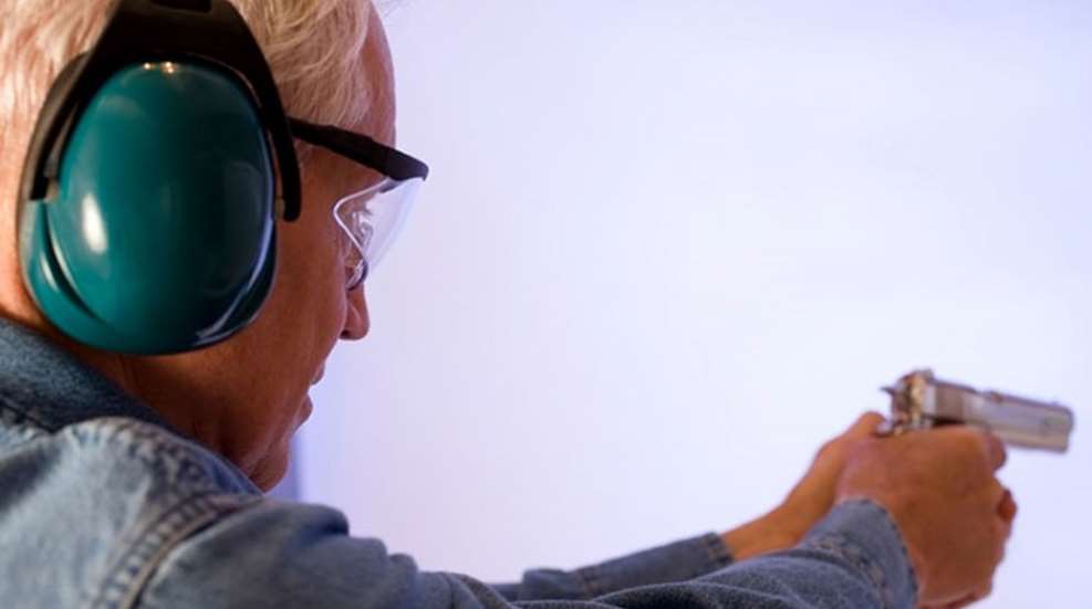 senior lady shooting pistol