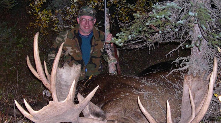 chris batin with downed moose