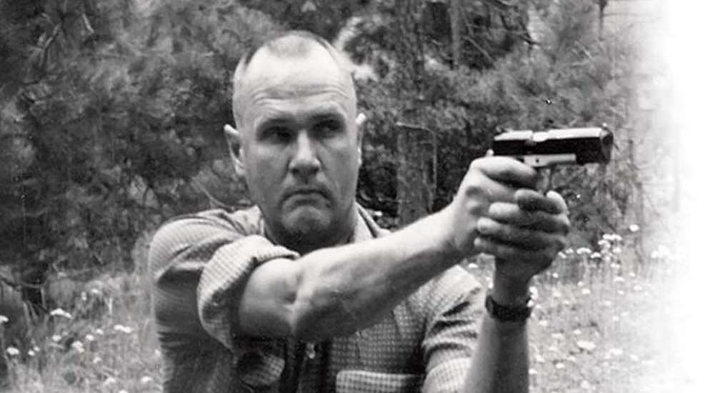 Jeff Cooper taking aim with pistol