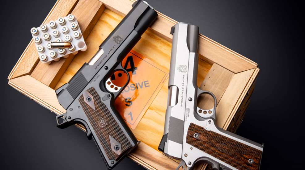 two springfield 1911 garrison handguns