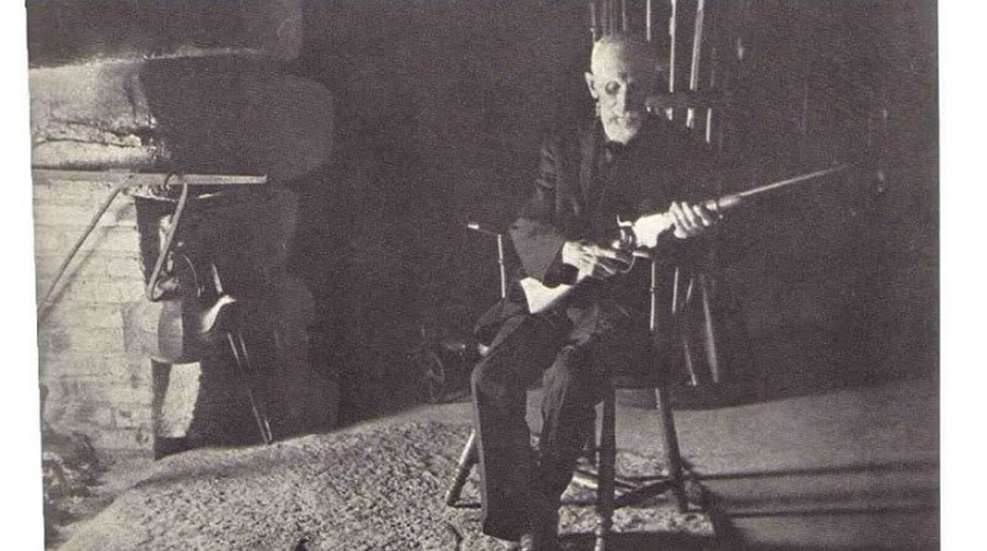 Historical photo of Christopher Miner Spencer with one of his shotguns