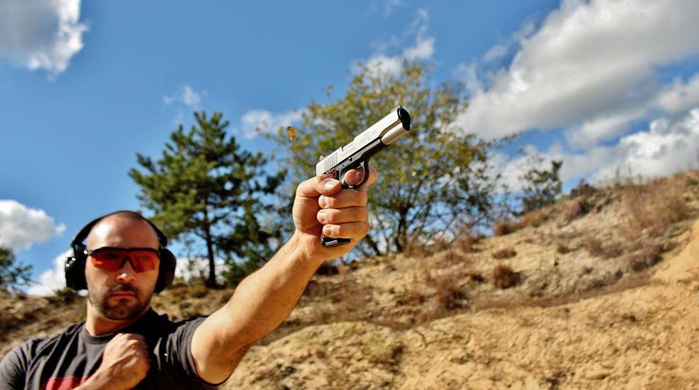 author shoots semi auto pistol one handed