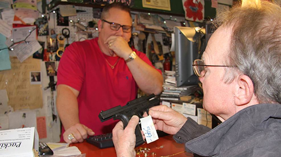 customer at pawn shop about to pay too much