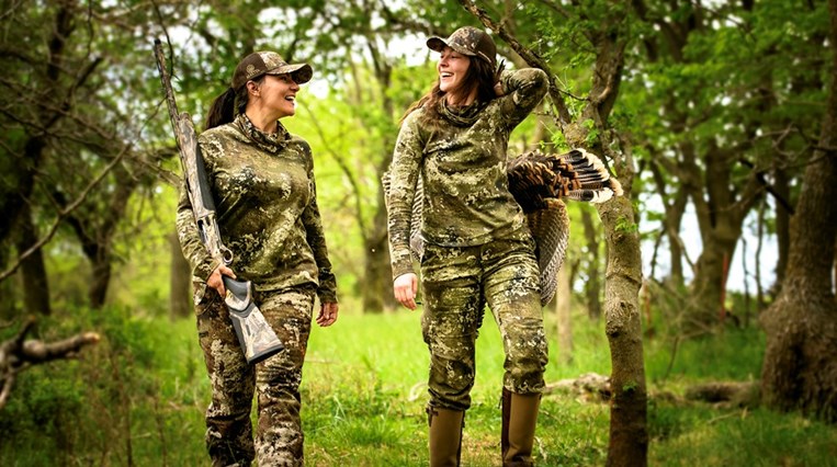 Suzi and Ashley with gun and turkey