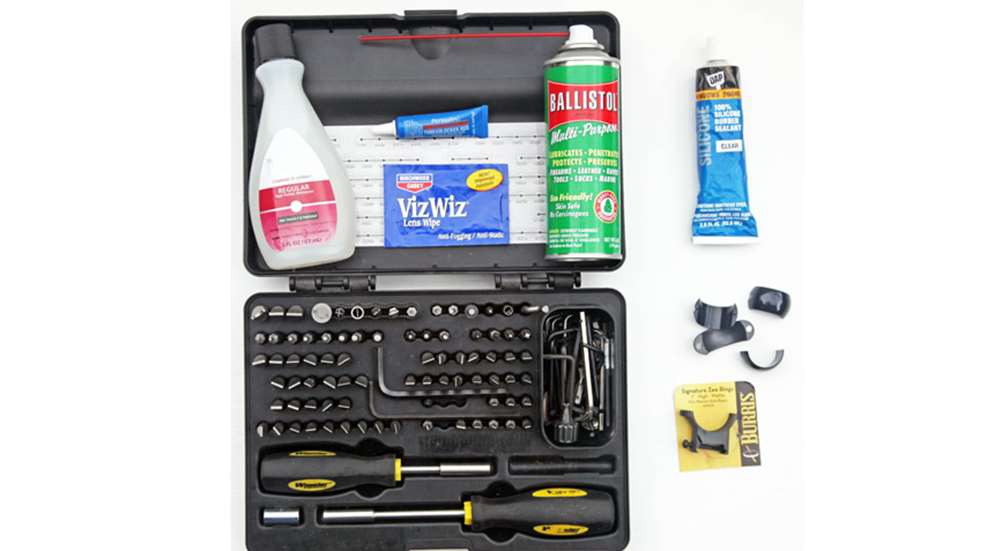 array of tools to care for gun and optic
